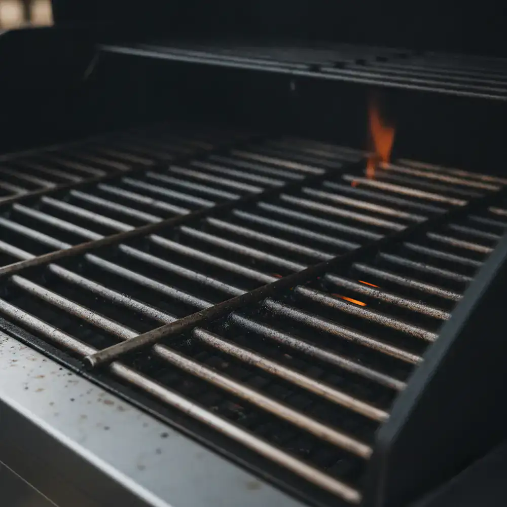 Close-up of thick stainless steel grill grates indicating durability